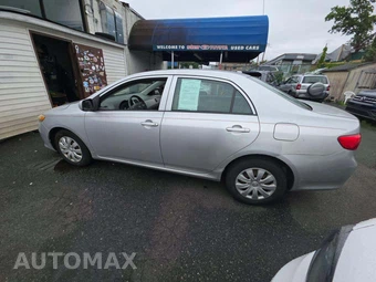 2009 Toyota Corolla LE - miniatura 2