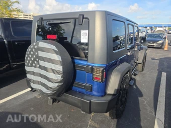 2010 Jeep Wrangler Unlimited Sport - miniatura 4