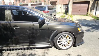 2011 Mitsubishi Lancer Evolution GSR - miniatura 5