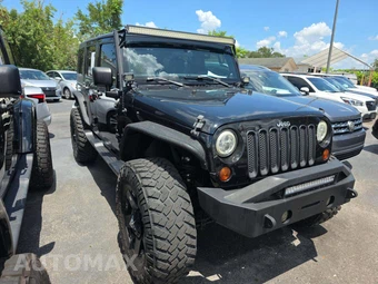 2012 Jeep Wrangler Unlimited Sport - miniatura 4
