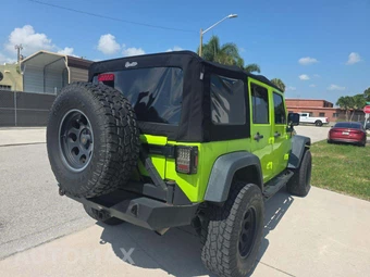 2013 Jeep Wrangler Unlimited Sport - miniatura 3