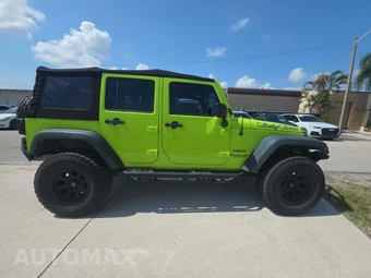 2013 Jeep Wrangler Unlimited Sport - miniatura 4
