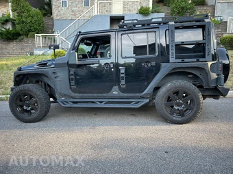 2014 Jeep Wrangler Unlimited Altitude Edition - miniatura 6