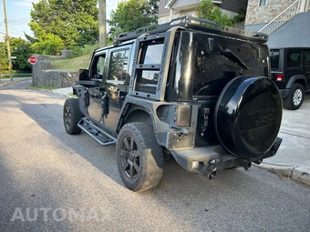 2014 Jeep Wrangler Unlimited Altitude Edition - miniatura 7