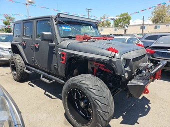2016 Jeep Wrangler Unlimited Sahara - miniatura 3